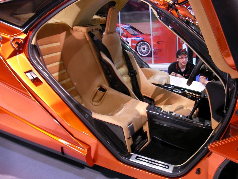 McLaren F1 cockpit with central driver seat and two flanking passenger seats