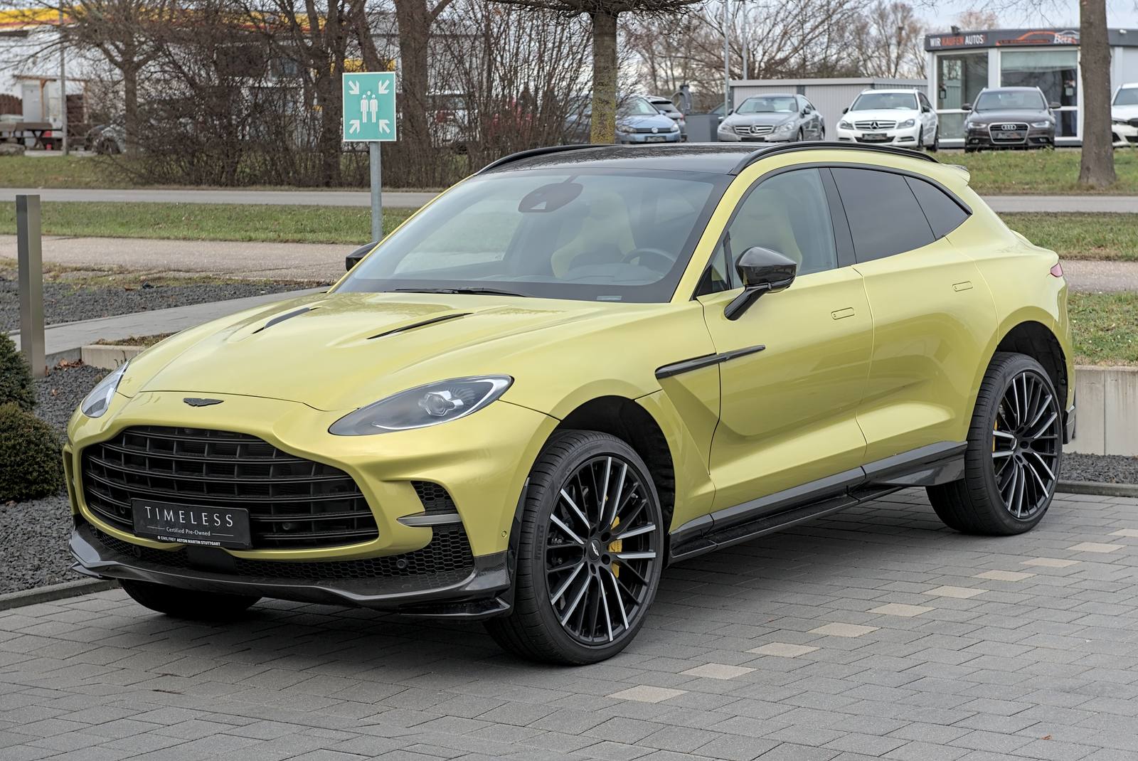 Lime-yellow Aston Martin DBX707 SUV, front three-quarter view, parked in Filderstadt