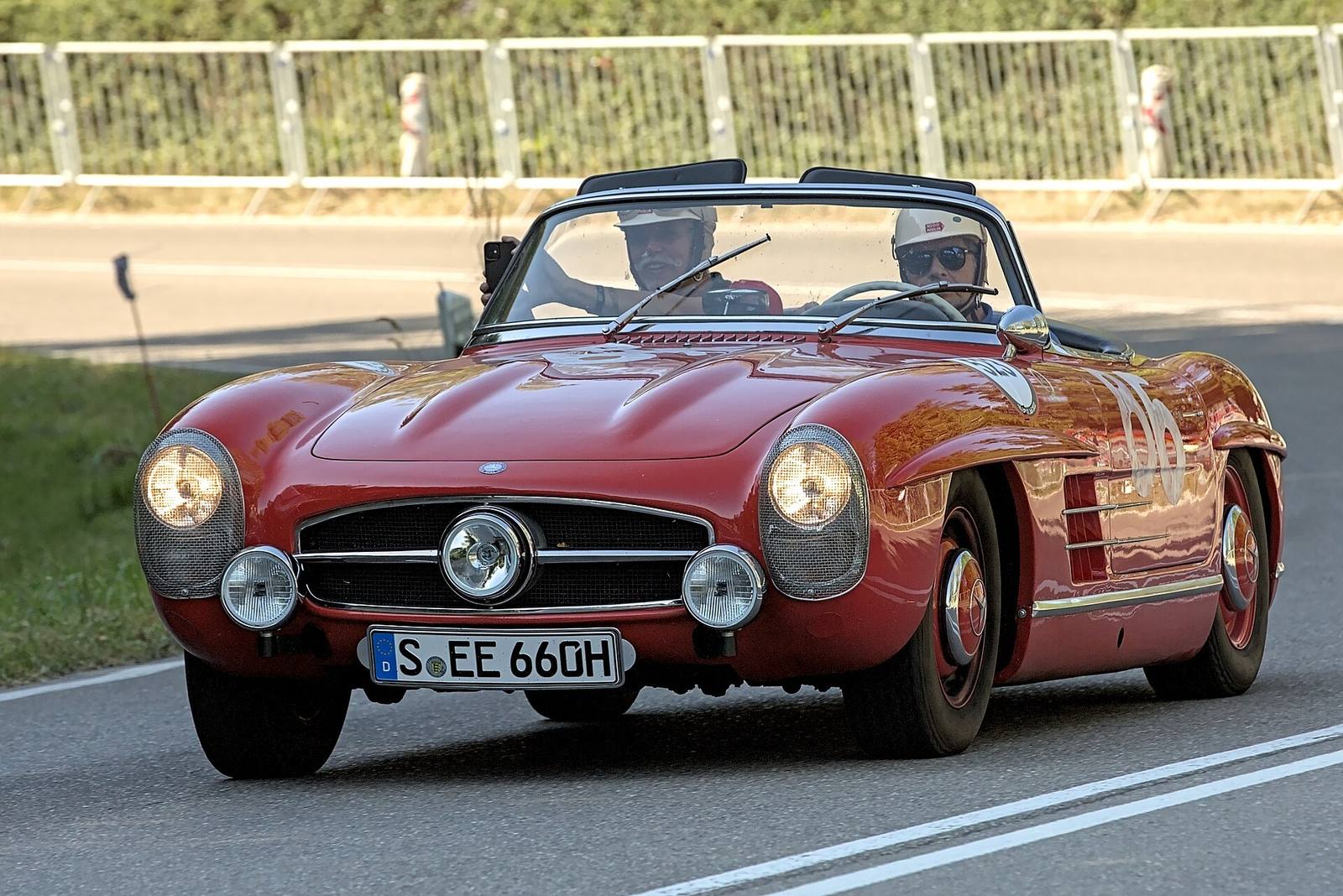 Silver 1957 Mercedes-Benz 300 SL Roadster at a historic racing event