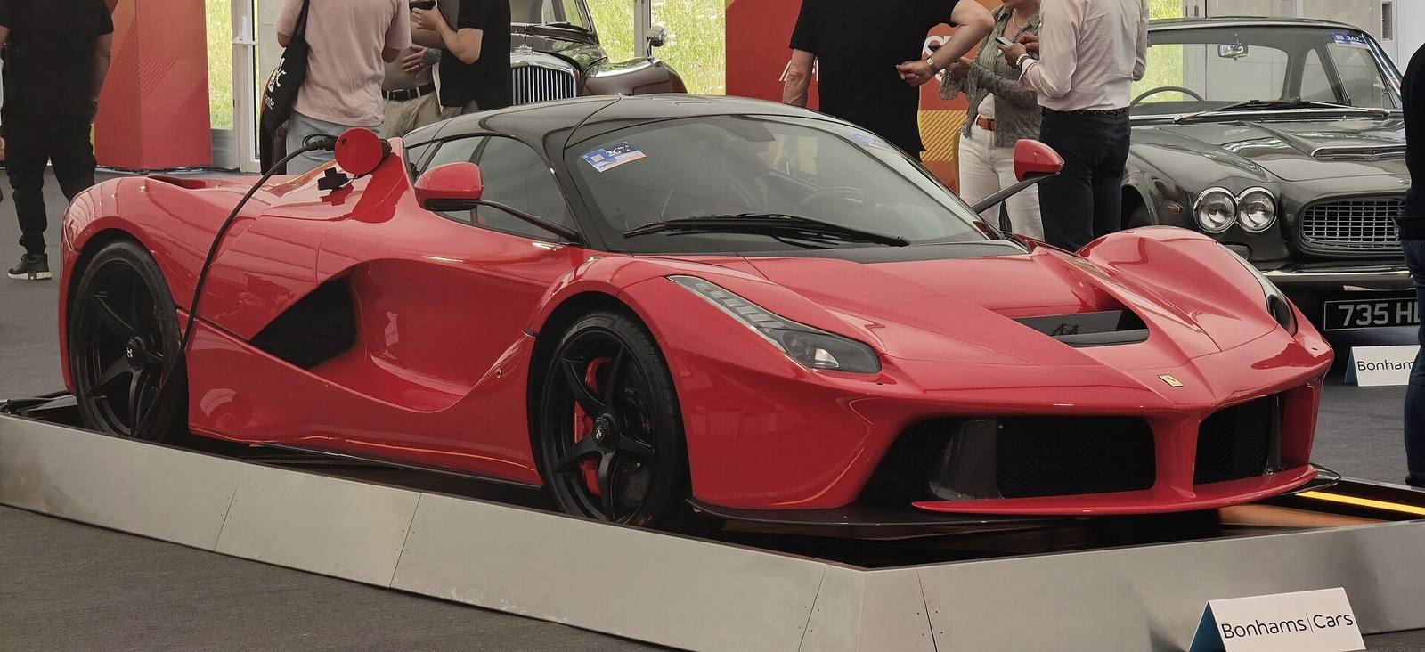 Red Ferrari LaFerrari on display at a concours event