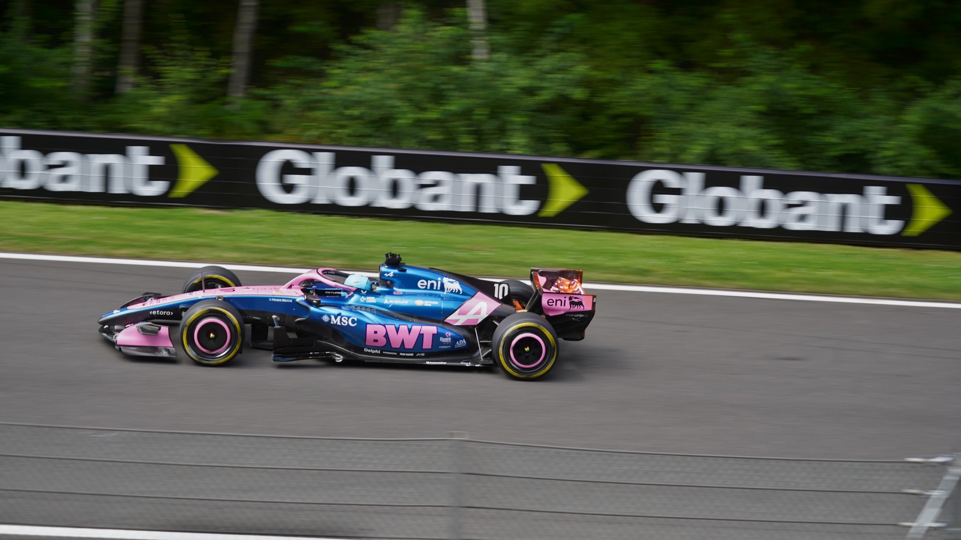 Blue and pink Alpine A526 Formula 1 car driven by Pierre Gasly at speed at Spa-Francorchamps, 2026