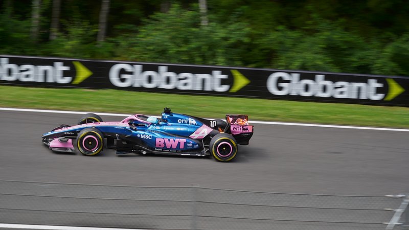 Blue and pink Alpine A526 Formula 1 car driven by Pierre Gasly at speed at Spa-Francorchamps, 2026