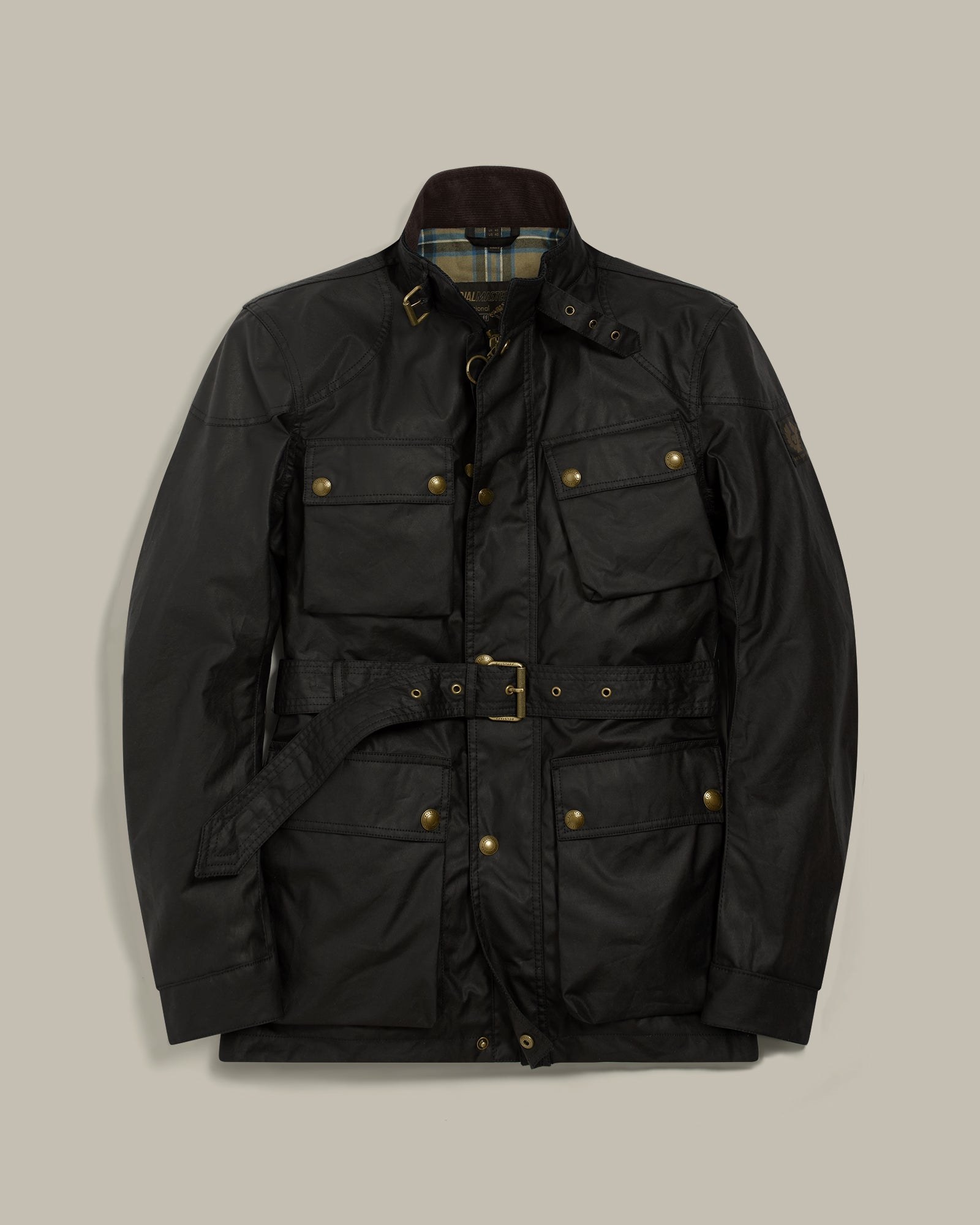 The Belstaff Trialmaster Icon Jacket in black waxed cotton photographed on a model, showing the four-pocket field layout, belted waist and corduroy collar
