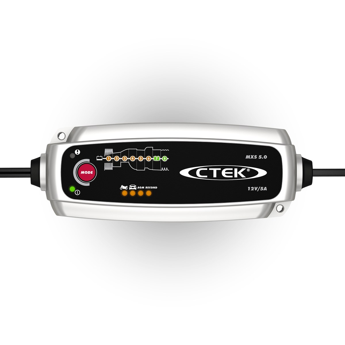 The CTEK MXS 5.0 battery charger photographed on a garage floor beside a car battery, its compact black and red housing and cable set clearly visible