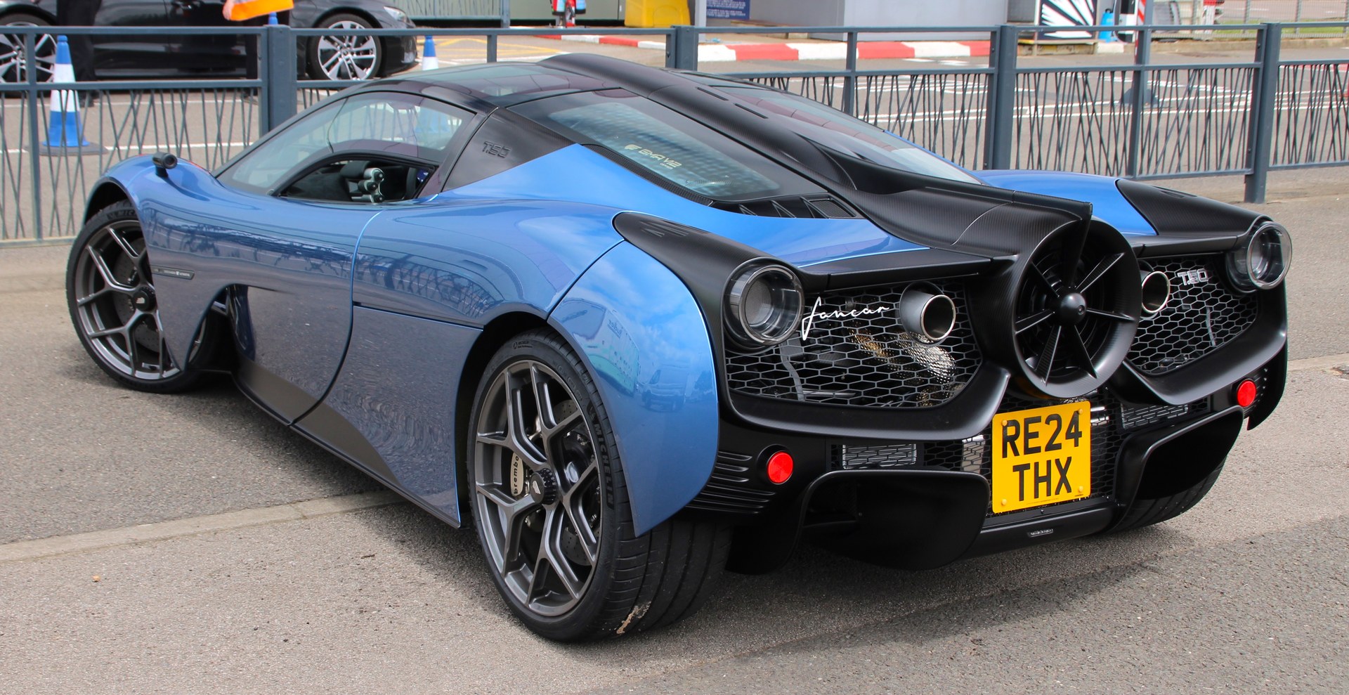 Rear three-quarter view of the Gordon Murray Automotive T.50 showing its circular rear cooling fan